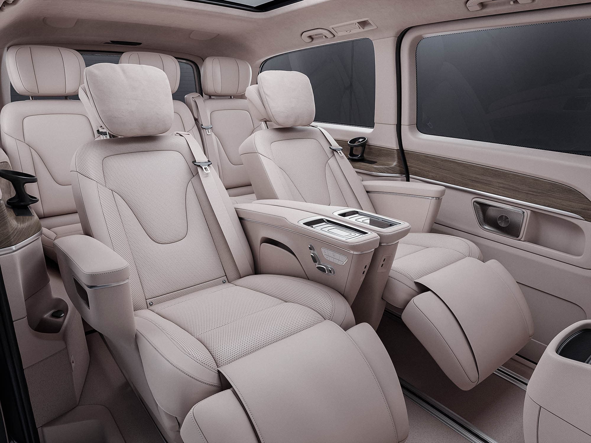 Rear cabin of the V-Class with beige leather seats and wood trim