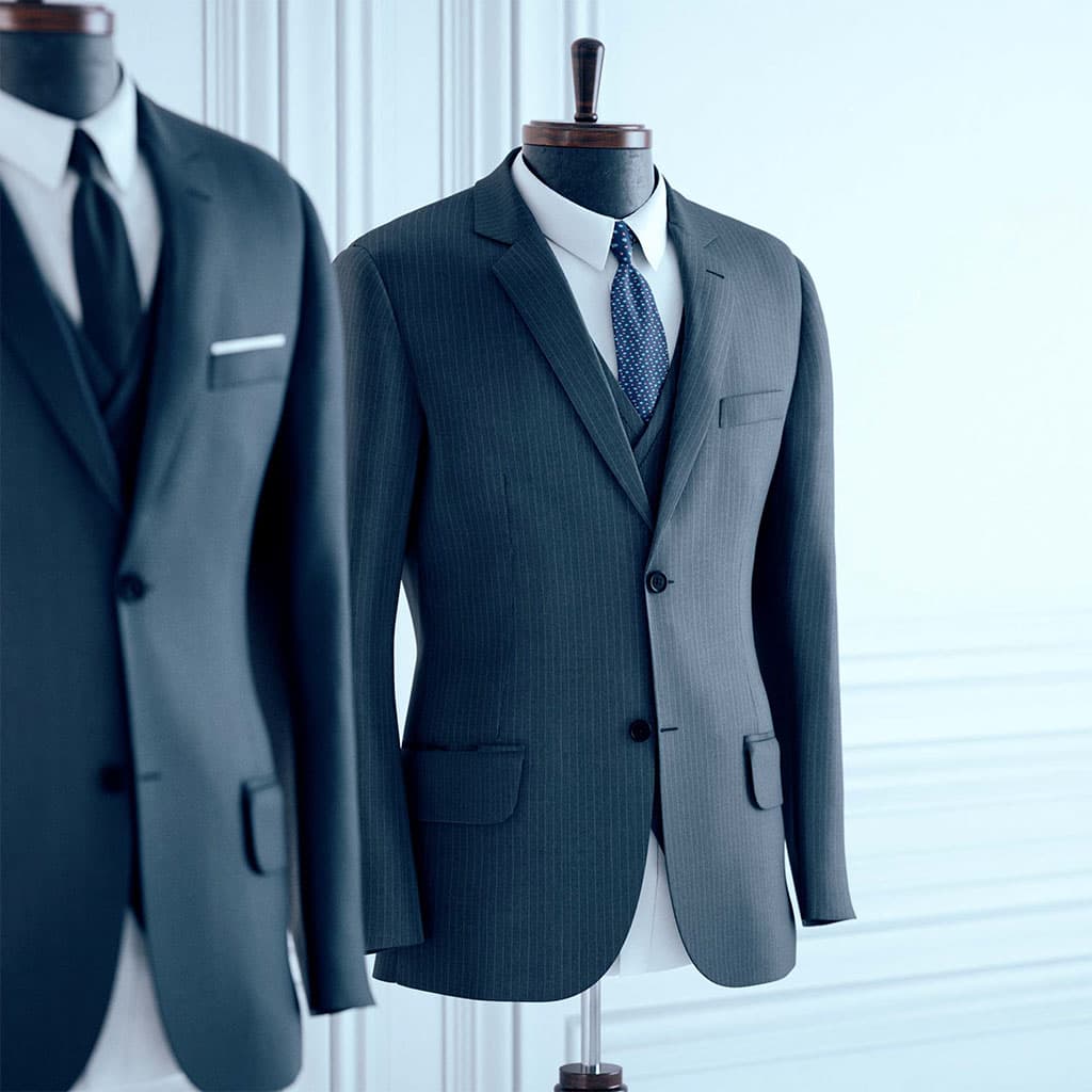 Tailored suits rendered in a bright, soft-lit studio